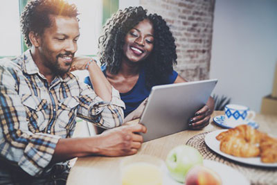 couple looking at tablet screen