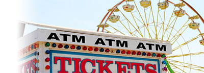 ticket booth with Ferris wheel in the background