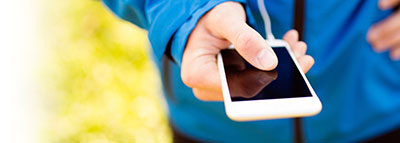 person holding cellphone touching screen