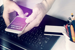 hands holding cellphone with online banking